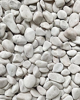 White smooth pebbles, natural stones. Backgrounds