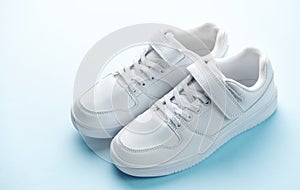 White sneakers on a blue background