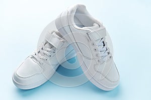 White sneakers on a blue background