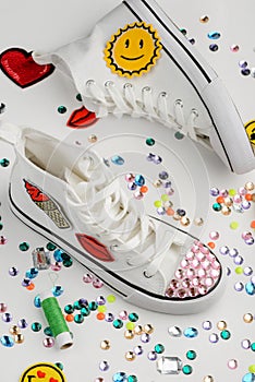 White sneakers decorated with rhinestones