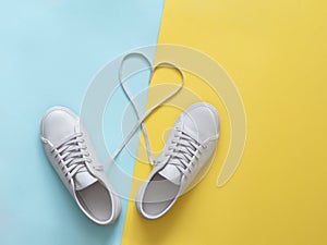 White sneakers with laces in heart shape