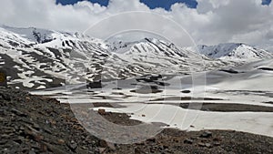 White snow melt mountain range on the road in northern of India