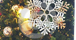 White snowflake colourful glittering baubles ornament ball decorated christmas tree. Holiday winter xmas happy new year festival