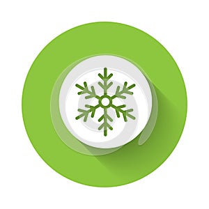 White Snowflake icon isolated with long shadow background. Merry Christmas and Happy New Year. Green circle button