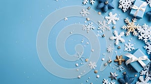 White snowflakes and blue gifts with bows on a blue background. Top view.Christmas bright background, banner with space for your