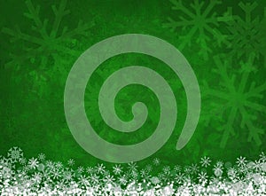 White snowflakes on green christmas background