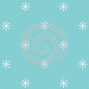 White snowflakes over blue backdrop. Pattern made with white snowflakes. Holidays concept.