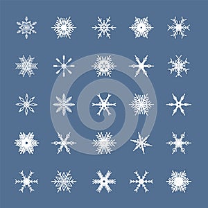 White snowflakes set isolated on blue background. Snow elements for Happy New Year and Merry Christmas holidays greeting