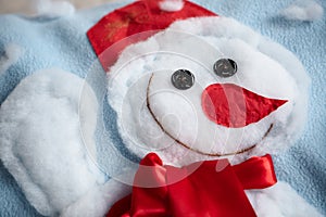 White snowman-appliquÃ© with button-eyes, red nose and cheerful smile