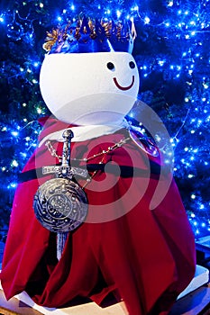 White snowman with red cloth in garden