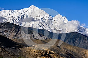 White snowy Nilgiri Mountain Peak seen from Kagbeni Village in Upper Mustang, Nepal