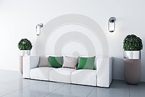 White sofa with green and pink cushions in a bright room with an empty space on the wall, corner view, 3d rendering, mock up