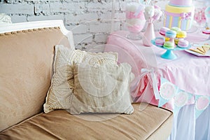 White sofa in a Provence style with well decorated pillows