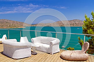 White sofas with Mirabello Bay view