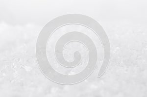 White soft light delicate abstract snow texture with snowflakes, closeup, blur band. Abstract winter snowy background.