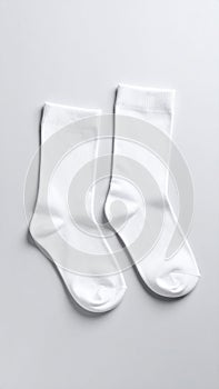 White, soft socks isolated in top view.