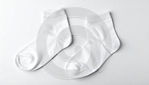 White, soft socks isolated in top view.