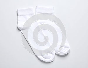 White, soft socks isolated in top view.