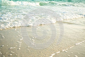White soft wave on sand beach with blue sea at coast top view