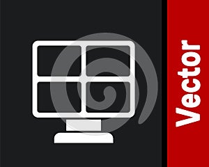 White Solar energy panel icon isolated on black background. Vector