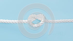 white solid rope with knot. High quality photo