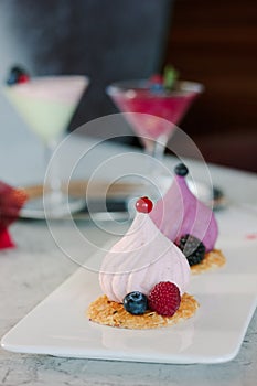 White soufle cake on white ceramic plate at restaurant.