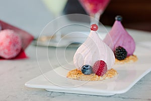 White soufle cake on white ceramic plate at restaurant.