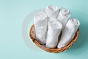 White spa towels on blue, from above