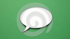 White speech bubble on green background