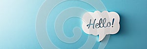 White speech bubble saying hello on blue background
