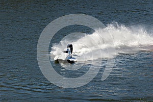 White Speedboat Making Turn on Water