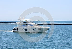 White speeding motor yacht