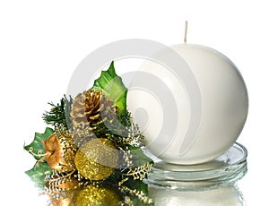 White spherical candle with christmas decoration