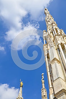 White Spiers and the Little Madonna is the highest point of the dome of the Duomo in Milan, Italy