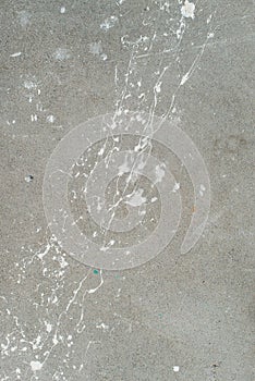 White splash on gray background concrete wall, messy, splotchy, surface. Decorative wet paint drops, abstract art. photo