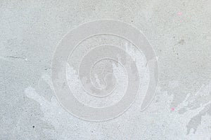 White splash on gray background concrete wall, messy, splotchy, surface. Decorative wet paint drops, abstract art. photo