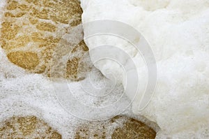 White sponge heap on seethe of the stream