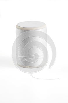 White spool has shadow on white background.