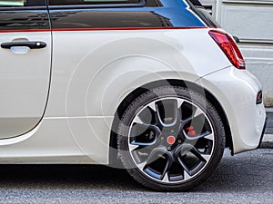 white sport car without a trade brand parked on the street