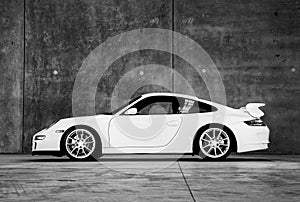 White Porsche Carrera sports car indoors