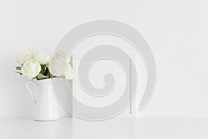 White square frame mockup with a bouquet of white roses in a vase on a white table