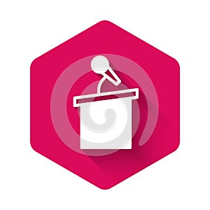 White Stage stand or debate podium rostrum icon isolated with long shadow. Conference speech tribune. Pink hexagon