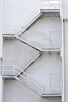 White stairs of a building for emergencies. photo