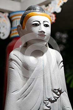 Standing Gautama Buddha at Haw Par Villa, Singapore photo