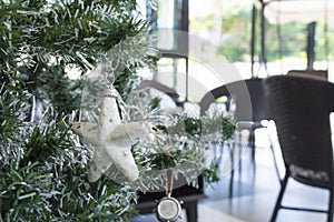 White star is decorated onâ€‹ pine tree.Merry christmasâ€‹ andâ€‹ happyâ€‹ newâ€‹ yearâ€‹ festivalâ€‹ concept.2023 happyâ€‹ day