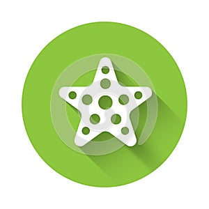 White Starfish icon isolated with long shadow. Green circle button. Vector