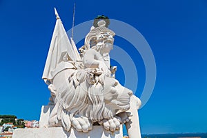 White statue above Lisbon