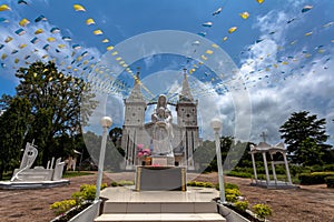 White statue of church of Saint Anna Nong Saeng and prayer colorful flags  at Nakhon Phanom Province, Thailand