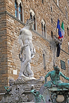 White statue of Neptune in the fountain in Florence