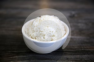 White steamed rice in a dish. Chinese Steamed Wite Rice in a white bowl. Chinese Lunch. White Rice